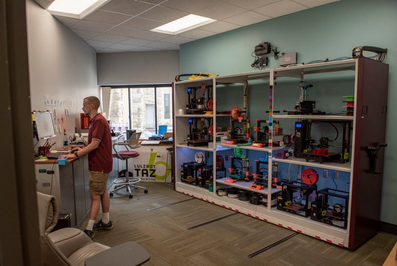 Employee in Newman Library 3D printing studio