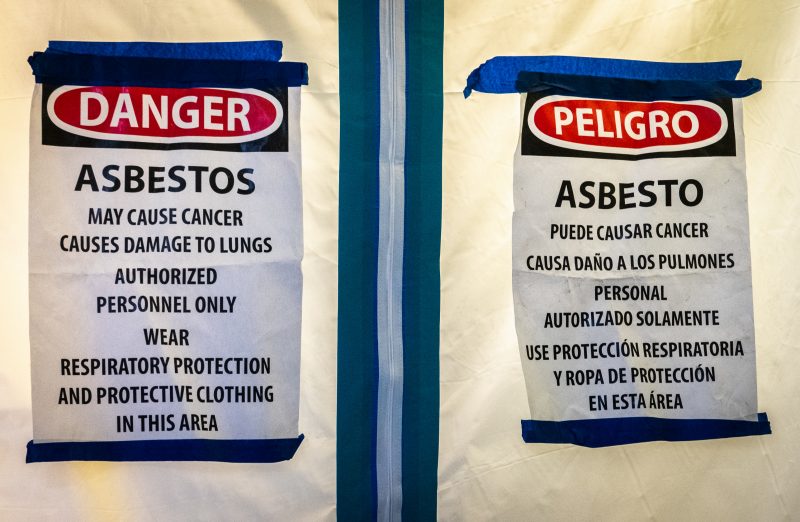 Asbestos sign on a containment unit