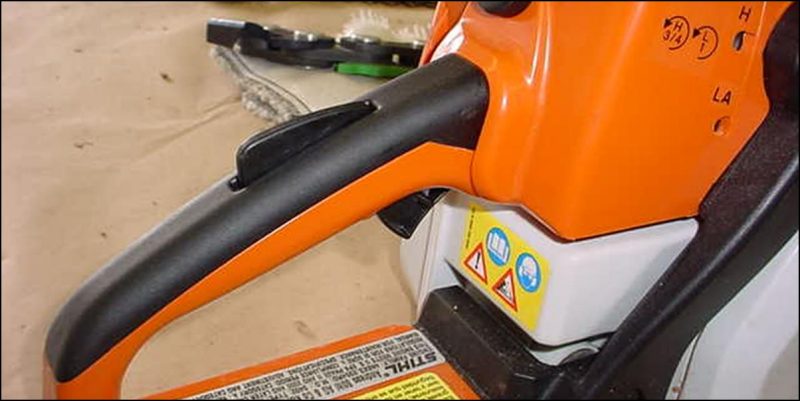 Chain saw throttle and lock