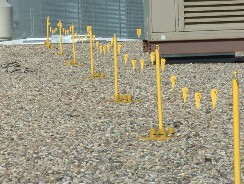 Yellow warning line on construction site roof