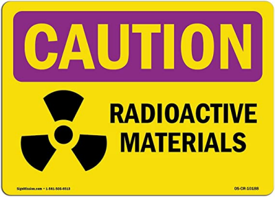 Pink and yellow sign - caution radioactive materials